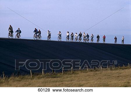 People riding bicycles at coast, Germany View Large Photo Image Stock Photo - People riding bicycles at coast, Germany . Fotosearch