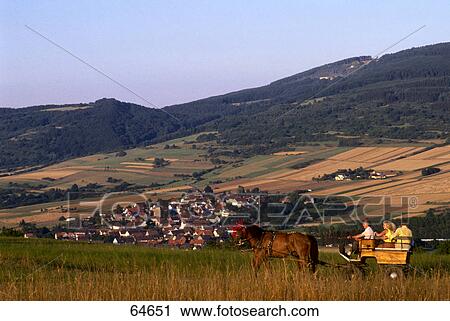 Stock Image - People riding in horse cart, Grossalmerode, Werra-Meißner, Hesse, Germany . Fotosearch
