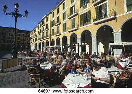 Stock Photo - People sitting at sidewalk cafe, Plaza del Mercado, Majorca, Balearic Islands, Spain . Fotosearch
