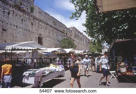 Stock Photo - People walking in market near city walls, Diocletian's Palace, Split, Croatia . Fotosearch