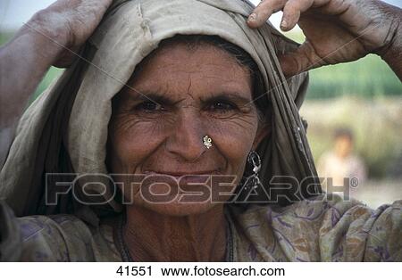 Stock Image - Portrait of woman smiling, Pakistan . Fotosearch