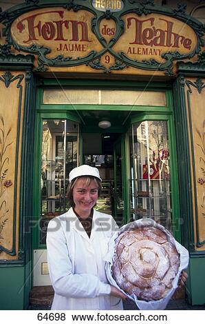 Portrait of young woman with pastry in front of store View Large Photo Image Stock Photo - Portrait of young woman with pastry in front of store . Fotosearch