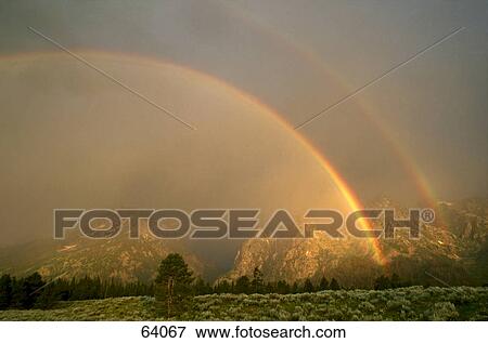 Rainbow over landscape, Grand Teton National Park, Wyoming, USA View Large Photo Image Stock Photo - Rainbow over landscape, Grand Teton National Park, Wyoming, USA . Fotosearch