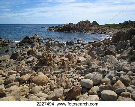 Rock formations on coast, Capo Comino, Italy View Large Photo Image Picture - Rock formations on coast, Capo Comino, Italy . Fotosearch