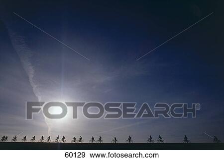 Silhouette of cyclists on landscape, Germany View Large Photo Image Stock Photo - Silhouette of cyclists on landscape, Germany . Fotosearch