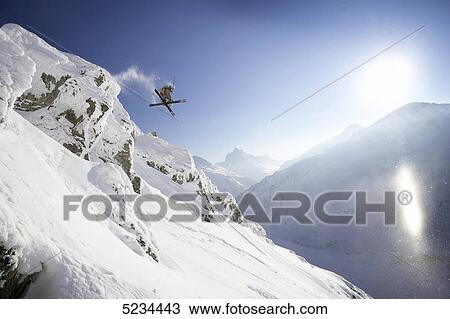 Skier doing a jump View Large Photo Image Stock Image - Skier doing a jump . Fotosearch