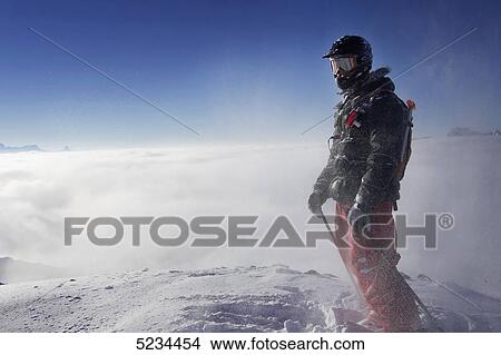 Skier on a peak View Large Photo Image Picture - Skier on a peak . Fotosearch
