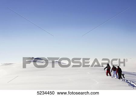 Stock Image - Skiers and snowboarders . Fotosearch