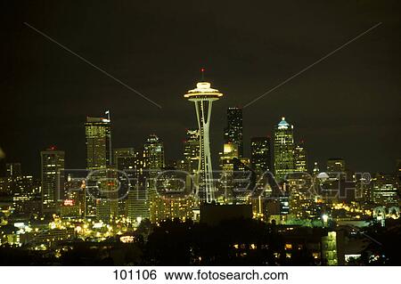 Stock Photograph - Skyscrapers lit up at night, Space Needle, Washington State, Usa . Fotosearch