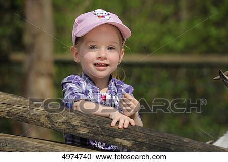 Smiling girl outdoors, portrait View Large Photo Image Stock Image - Smiling girl outdoors, portrait . Fotosearch