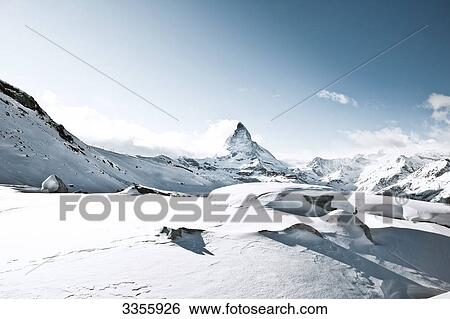 Snow-covered mountains in Zermatt, Switzerland View Large Photo Image Stock Photograph - Snow-covered mountains in Zermatt, Switzerland . Fotosearch