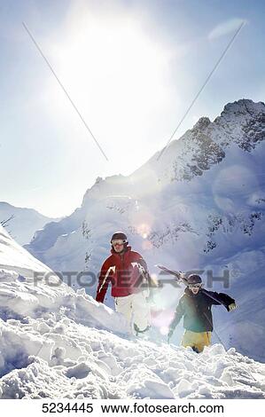 Stock Photography - Snowboarder and skier at the Arlberg . Fotosearch