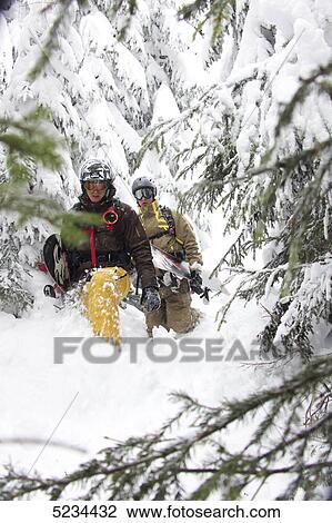 Stock Image - Snowboarder in deep snow . Fotosearch