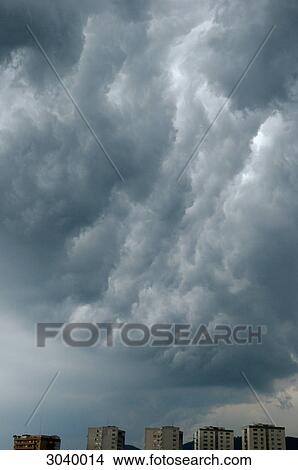 Picture - Storm clouds over a cityscape . Fotosearch