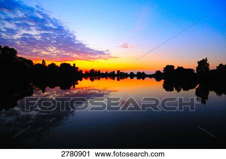 Sunset over lake, Altmuhl Lake, Bavaria, Germany View Large Photo Image Stock Image - Sunset over lake, Altmuhl Lake, Bavaria, Germany . Fotosearch