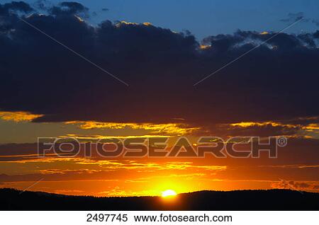 Stock Photography - Sunset over landscape . Fotosearch