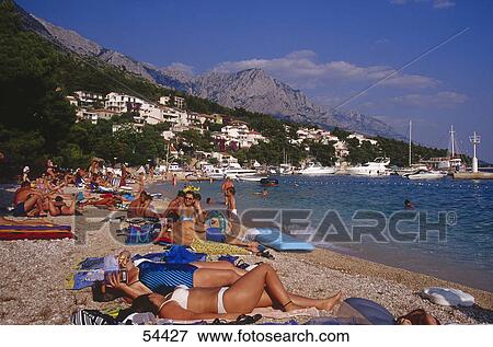 Tourist on beach, Brela, Croatia View Large Photo Image Stock Photo - Tourist on beach, Brela, Croatia . Fotosearch