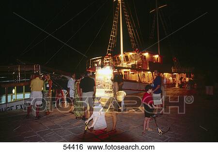 Stock Photograph - Tourists at harbor, Baska Voda, Croatia . Fotosearch