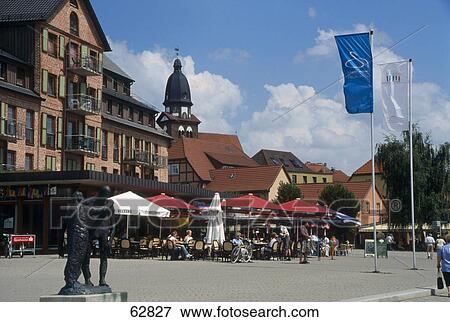 Tourists at outdoor cafe in street, Waren, Mecklenburg-Vorpommern, Germany View Large Photo Image Stock Photo - Tourists at outdoor cafe in street, Waren, Mecklenburg-Vorpommern, Germany . Fotosearch