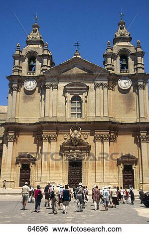 Stock Photograph - Tourists in front of cathedral, St. Peter Cathedral, St. Paul Cathedral, Mdina, Malta . Fotosearch