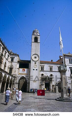 Stock Photo - Tourists in front of clock tower, Dubrovnik, Croatia . Fotosearch