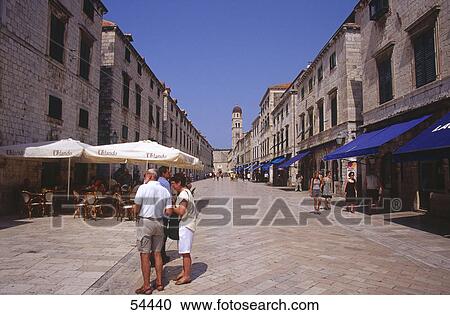 Stock Image - Tourists near outdoor cafe, Dubrovnik, Croatia . Fotosearch