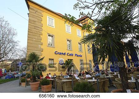Tourists sitting in front of coffeehouse, Stuttgart, Baden-Wuerttemberg, Germany View Large Photo Image Stock Image - Tourists sitting in front of coffeehouse, Stuttgart, Baden-Wuerttemberg, Germany . Fotosearch