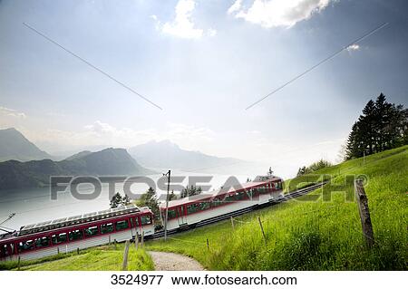 Train passing rural landscape, elevated view View Large Photo Image Stock Photo - Train passing rural landscape, elevated view . Fotosearch