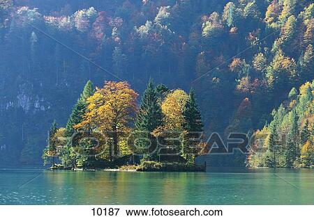 Stock Photo - Trees on small island in lake, Konigssee, Berchtesgaden, Bavaria, Germany . Fotosearch
