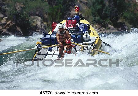 Two people white water rafting in rapid river, Colorado River, Arizona, USA View Large Photo Image Stock Image - Two people white water rafting in rapid river, Colorado River, Arizona, USA . Fotosearch