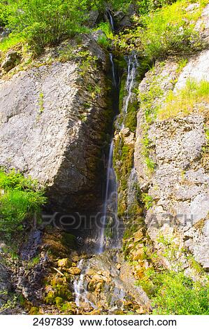 Stock Photo - Water falling through rocks, Styria, Austria . Fotosearch