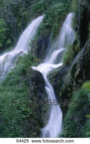 Stock Photography - Waterfall cascading in a forest, Croatia . Fotosearch