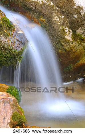 Stock Photograph - Waterfall in forest, Styria, Austria . Fotosearch