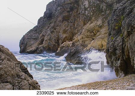 Waves breaking against rocks, Balkans, Croatia View Large Photo Image Stock Photography - Waves breaking against rocks, Balkans, Croatia . Fotosearch