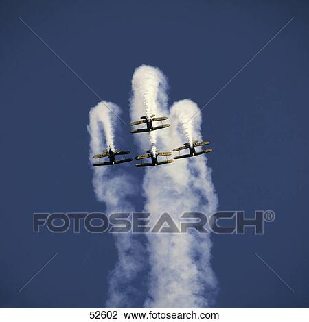 Stock Image - Acrobatic biplanes flying in sky, Opa-locka, Florida, USA . Fotosearch