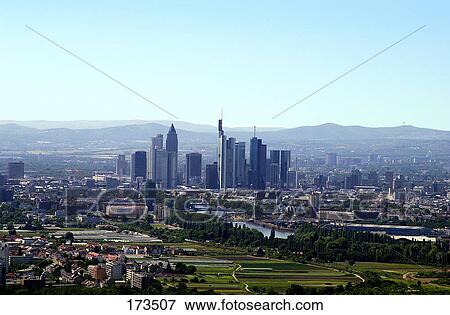 Aerial view of buildings and river in city with Taunus mountains in background, Main River, Frankfurt, Hessen, Germany View Large Photo Image Stock Photo - Aerial view of buildings and river in city with Taunus mountains in background, Main River, Frankfurt, Hessen, Germany . Fotosearch