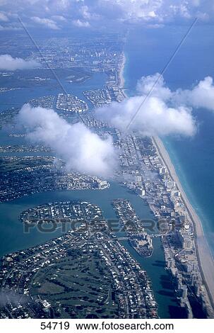 Stock Photo - Aerial view of city at seaside, Miami, Florida, USA . Fotosearch