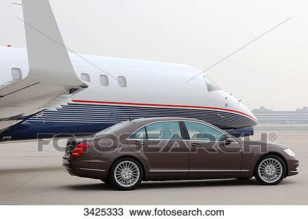 Airplane and car on a landing strip, side view View Large Photo Image Stock Image - Airplane and car on a landing strip, side view . Fotosearch