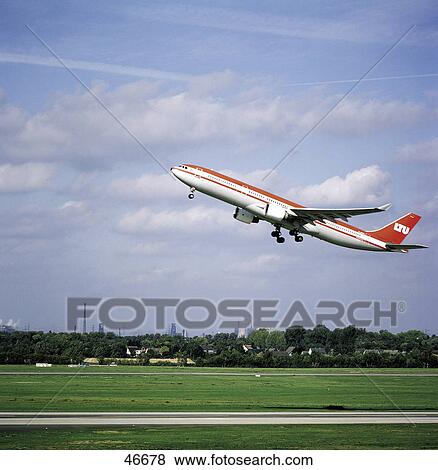 Airplane taking off from runway View Large Photo Image Stock Photo - Airplane taking off from runway . Fotosearch