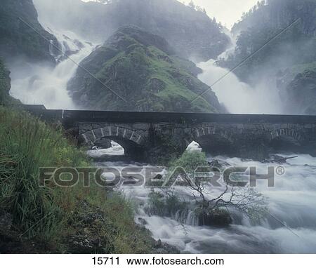 Arch bridge across river, Latefoss Bridge, Latefossen Waterfall, Skarsfossen Waterfall, Odda, Hordaland County, Norway View Large Photo Image Stock Image - Arch bridge across river, Latefoss Bridge, Latefossen Waterfall, Skarsfossen Waterfall, Odda, Hordaland County, Norway . Fotosearch
