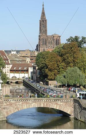 Stock Photo - Arch bridge with church in background, Petite France, Strasbourg, Bas-Rhin, Alsace, France . Fotosearch