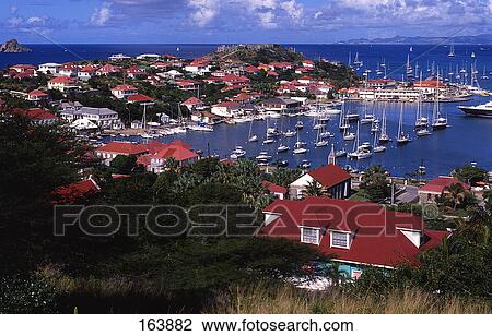 Stock Image - Boats at harbor, Gustavia Harbor, Saint Barthelmy, French Antilles . Fotosearch