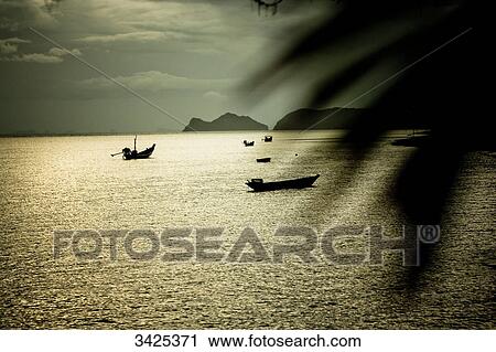 Stock Image - Boats at the coast of Ko Phangan, Thailand, elevated view . Fotosearch