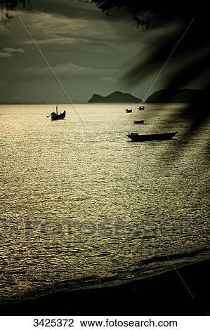 Stock Image - Boats at the coast of Ko Phangan, Thailand, elevated view . Fotosearch