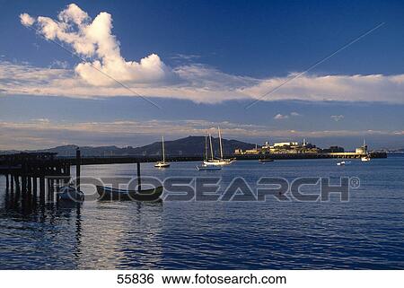 Boats in bay with prison in background, Alcatraz Island, San Francisco, California, USA View Large Photo Image Stock Photograph - Boats in bay with prison in background, Alcatraz Island, San Francisco, California, USA . Fotosearch