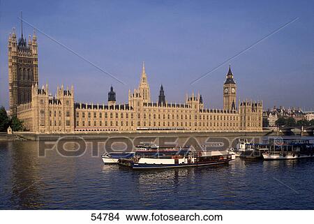 Boats in river in front of government building, Houses of Parliament, Thames River, City Of Westminster, London, England View Large Photo Image Picture - Boats in river in front of government building, Houses of Parliament, Thames River, City Of Westminster, London, England . Fotosearch