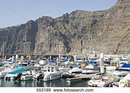 Stock Photo - Boats moored at harbor, Los Gigantes, Santiago Del Teide, Tenerife, Canary Islands, Spain . Fotosearch