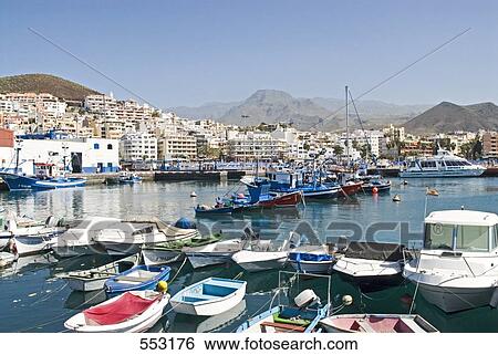Boats moored on harbor, Los Cristianos, Tenerife, Canary Islands, Spain View Large Photo Image Stock Photograph - Boats moored on harbor, Los Cristianos, Tenerife, Canary Islands, Spain . Fotosearch