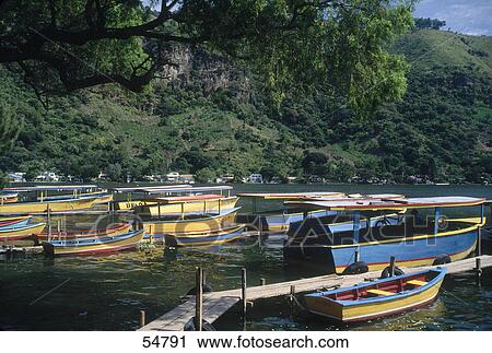 Boats moored on shore of lake, lake Amatitlan, Guatemala View Large Photo Image Stock Image - Boats moored on shore of lake, lake Amatitlan, Guatemala . Fotosearch