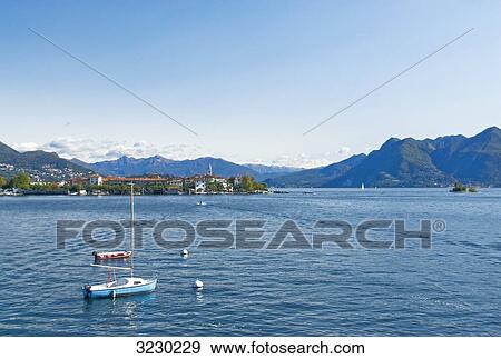 Boats on the lake Lago Maggiore, Isola dei Pescatori in the background, Piedmont, italy View Large Photo Image Stock Photo - Boats on the lake Lago Maggiore, Isola dei Pescatori in the background, Piedmont, italy . Fotosearch